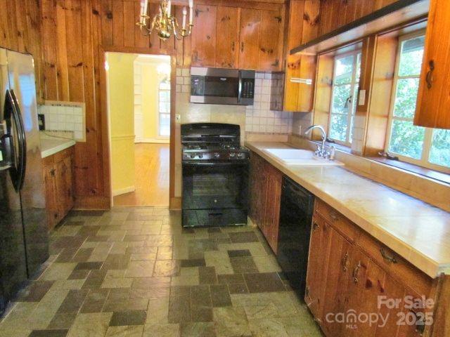 3465 Lynn Road Tryon, NC 28782 - Photo 19 of 31 a kitchen with stainless steel appliances a stove a sink and a refrigerator
