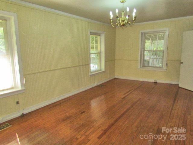 3465 Lynn Road Tryon, NC 28782 - Photo 23 of 31 a view of an empty room with chandelier and a window