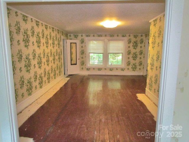 3465 Lynn Road Tryon, NC 28782 - Photo 29 of 31 a view of an empty room with wooden floor and a window