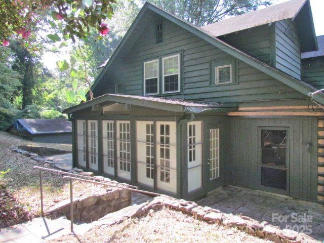 3465 Lynn Road Tryon, NC 28782 - Photo 3 of 31 a front view of a house with a yard