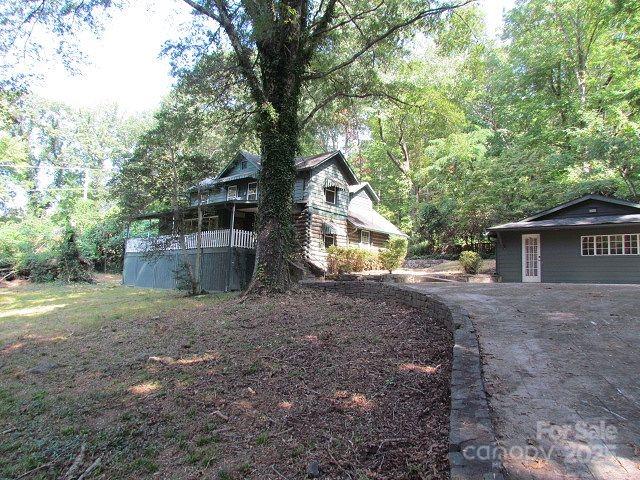 3465 Lynn Road Tryon, NC 28782 - Photo 31 of 31 a view of a house with a yard