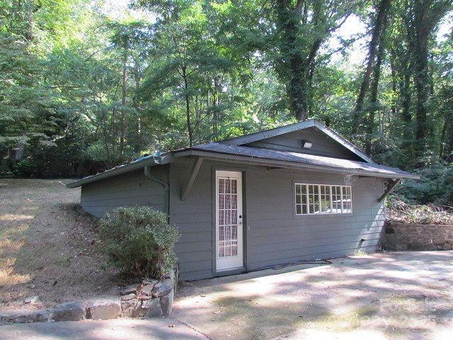 3465 Lynn Road Tryon, NC 28782 - Photo 5 of 31 a view of a house with a yard
