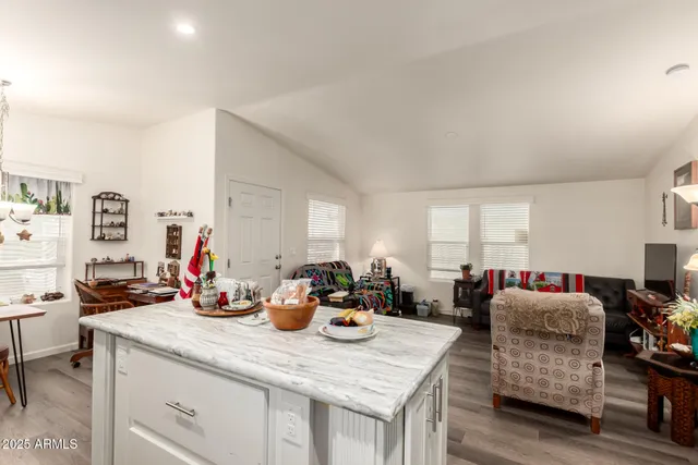 a kitchen view with dining table and chairs
