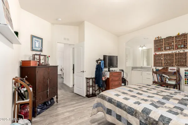 a bedroom with a bed and furniture
