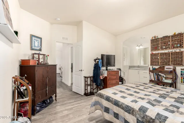 a bedroom with a bed and furniture