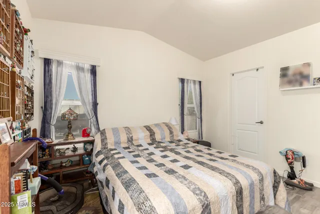 a bedroom with a bed and a table