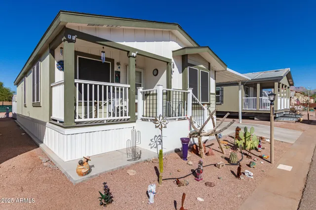 a front view of a house with sitting area