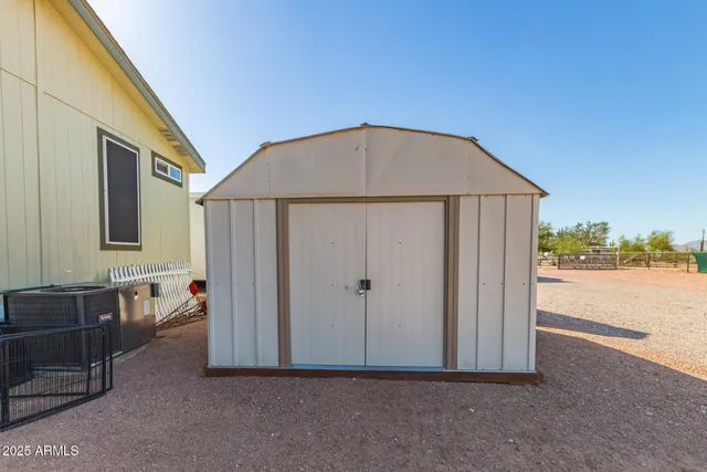 a view of backyard with lake view and wooden floor