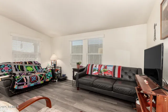 a bedroom with a bed and a couch