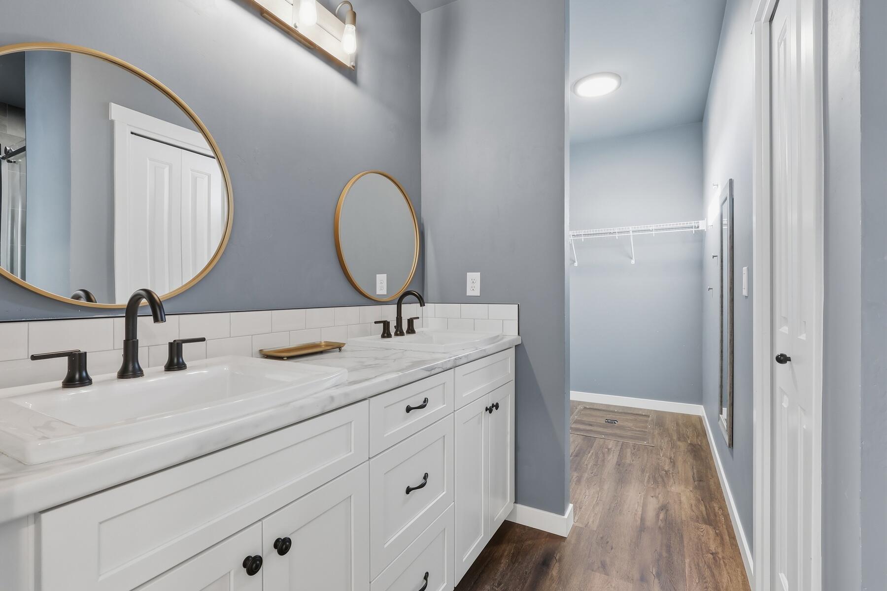 16455 Bassett Road La Pine, OR 97739 - Photo 15 of 44 a bathroom with a double vanity sink and a mirror