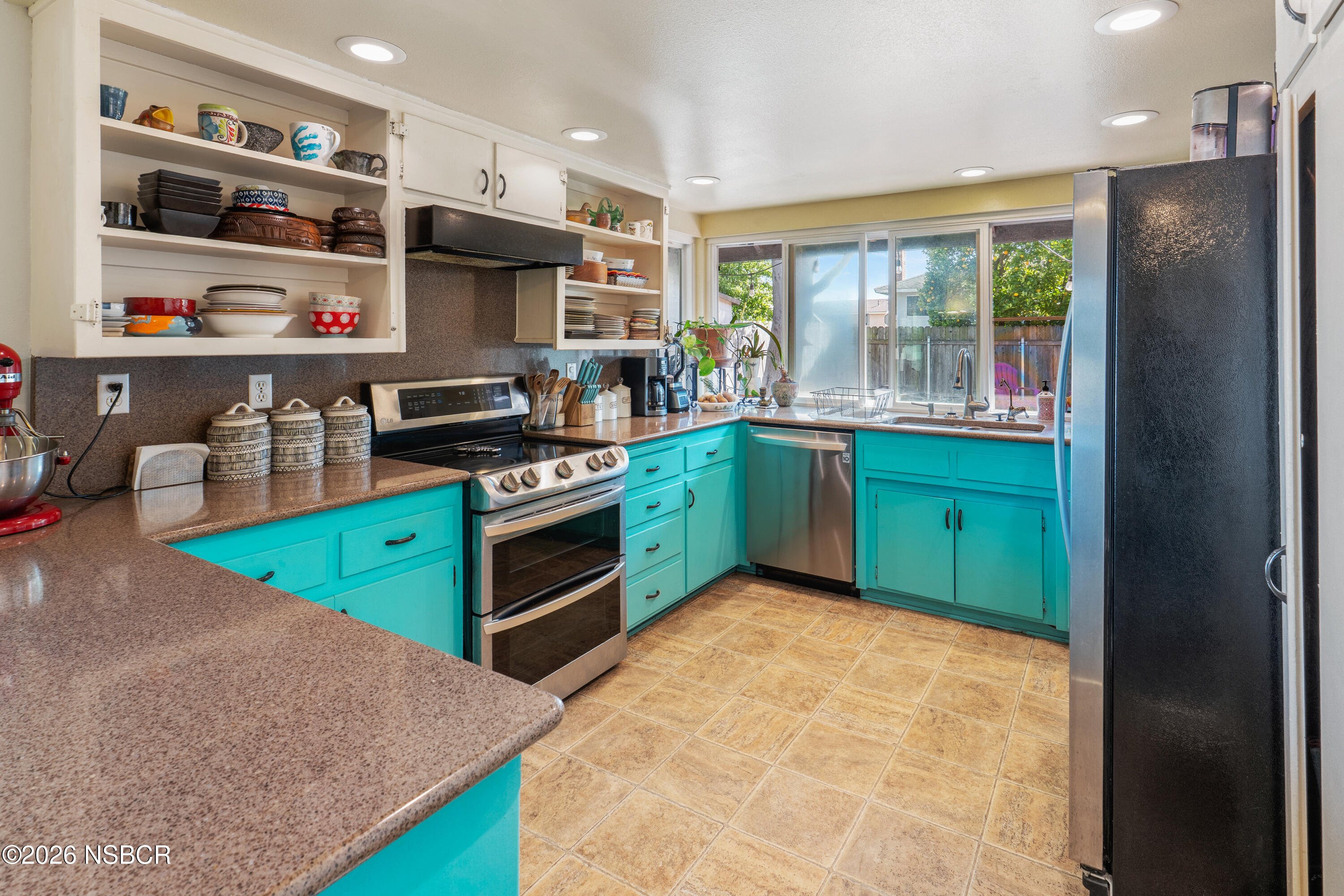 4220 Constellation Road Lompoc, CA 93436 - Photo 10 of 22 a kitchen with stainless steel appliances granite countertop a refrigerator and a stove