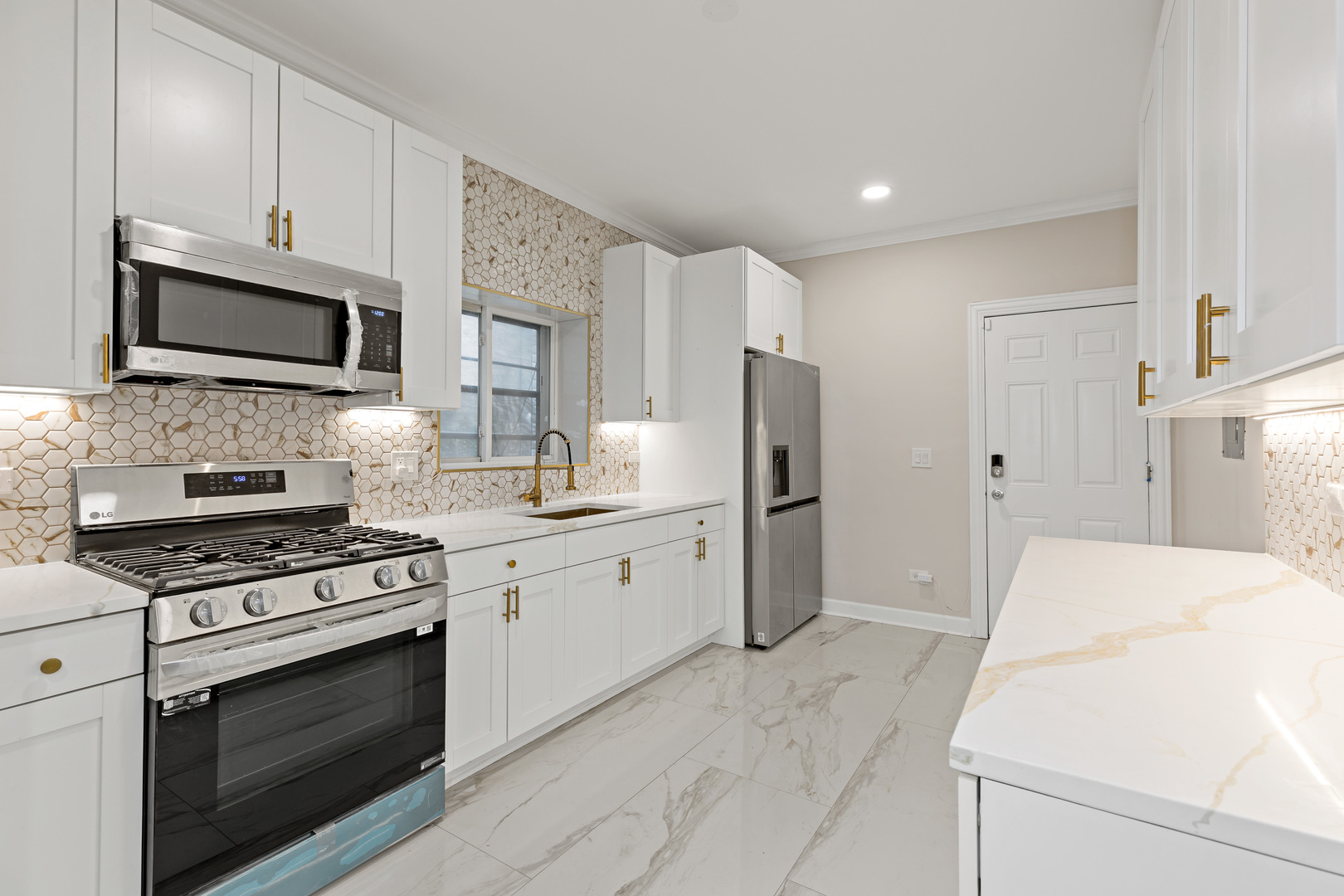 1742 North Mayfield Avenue Chicago, IL 60639 - Photo 6 of 10 a kitchen with stainless steel appliances a refrigerator stove and microwave