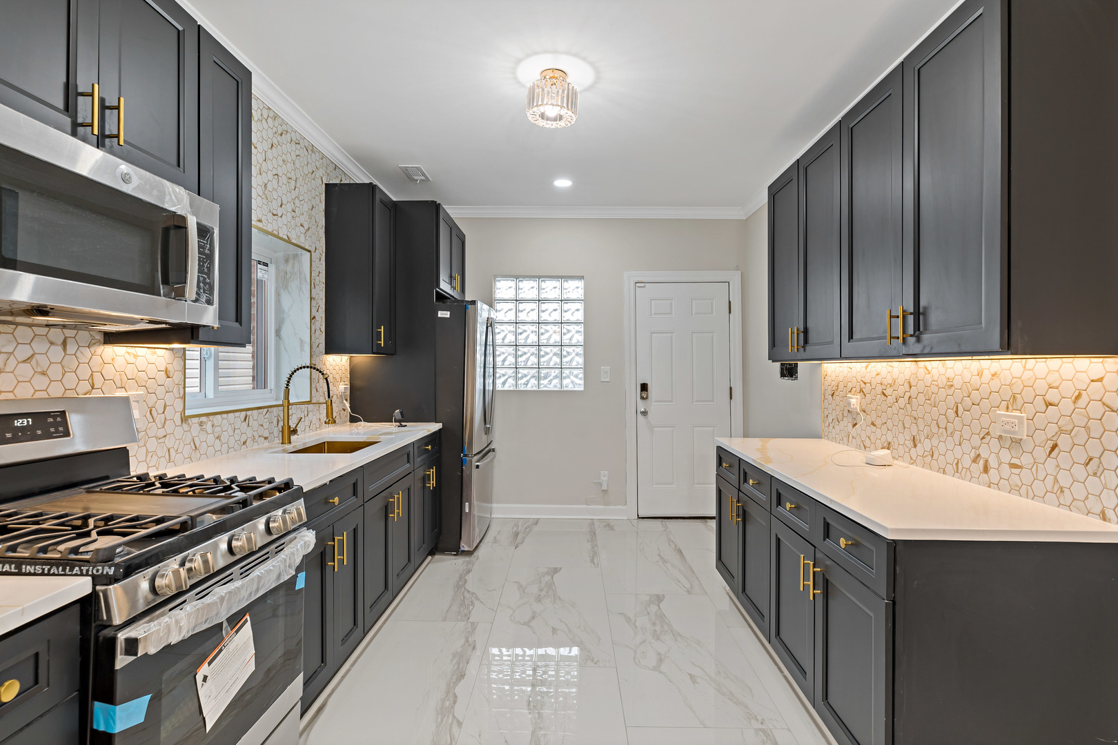 1742 North Mayfield Avenue Chicago, IL 60639 - Photo 7 of 10 a kitchen with a stove sink and microwave