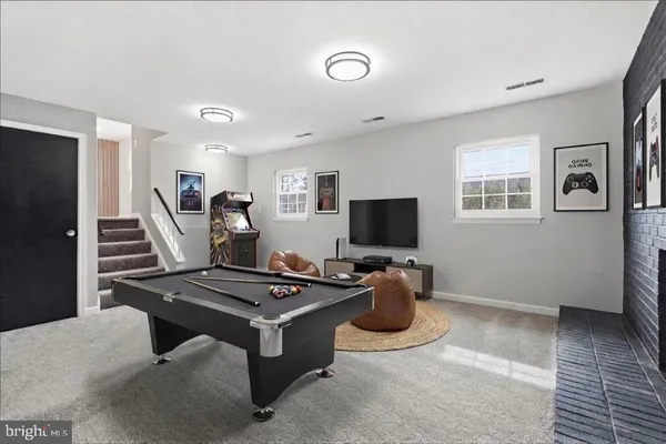 a bedroom with furniture and a flat screen tv