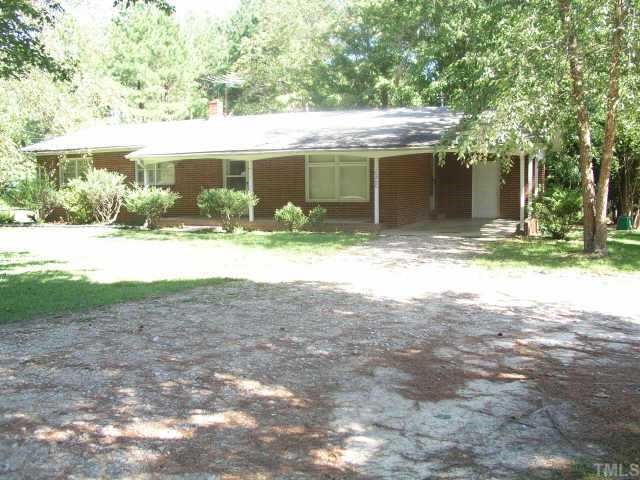 10200 Six Forks Road Raleigh, NC 27615 - Photo 1 of 1 a view of a house with backyard and a tree