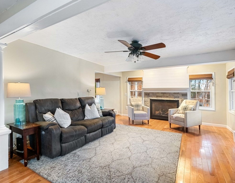 3 Upton Road Westborough, MA 01581 - Photo 12 of 34 a living room with furniture and a fireplace
