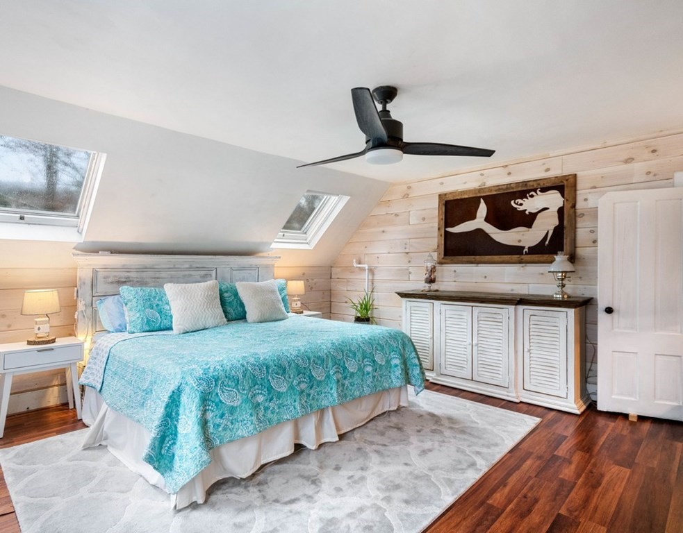 3 Upton Road Westborough, MA 01581 - Photo 16 of 34 a bedroom with a bed and wooden floor