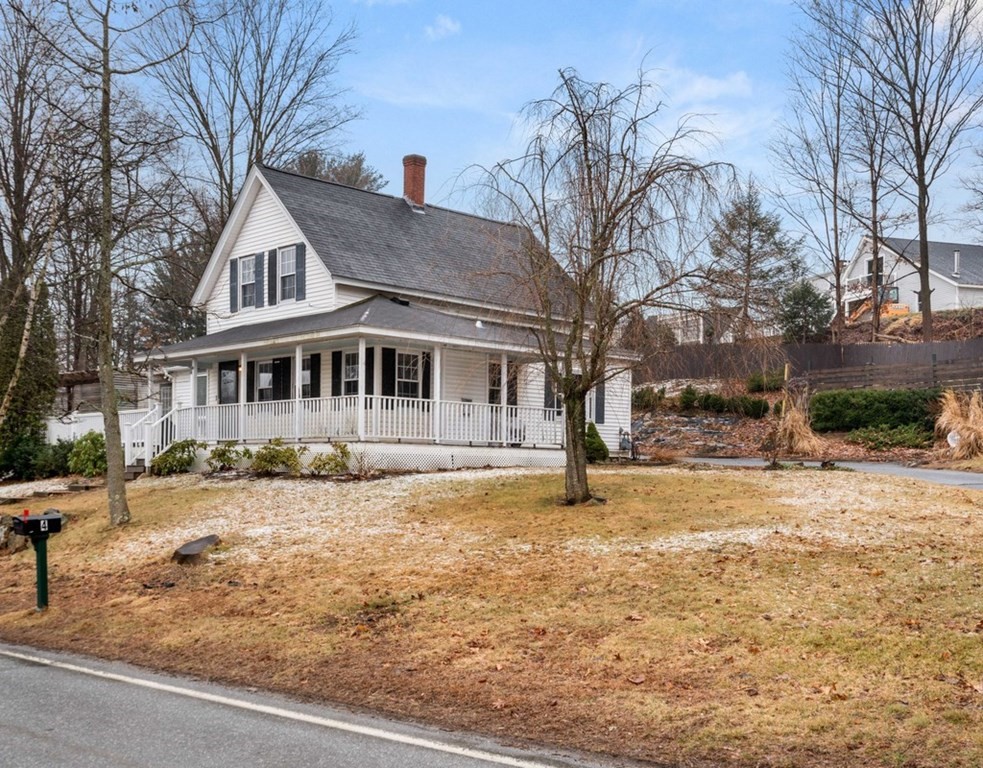 3 Upton Road Westborough, MA 01581 - Photo 22 of 34 a front view of a house with a yard covered in snow