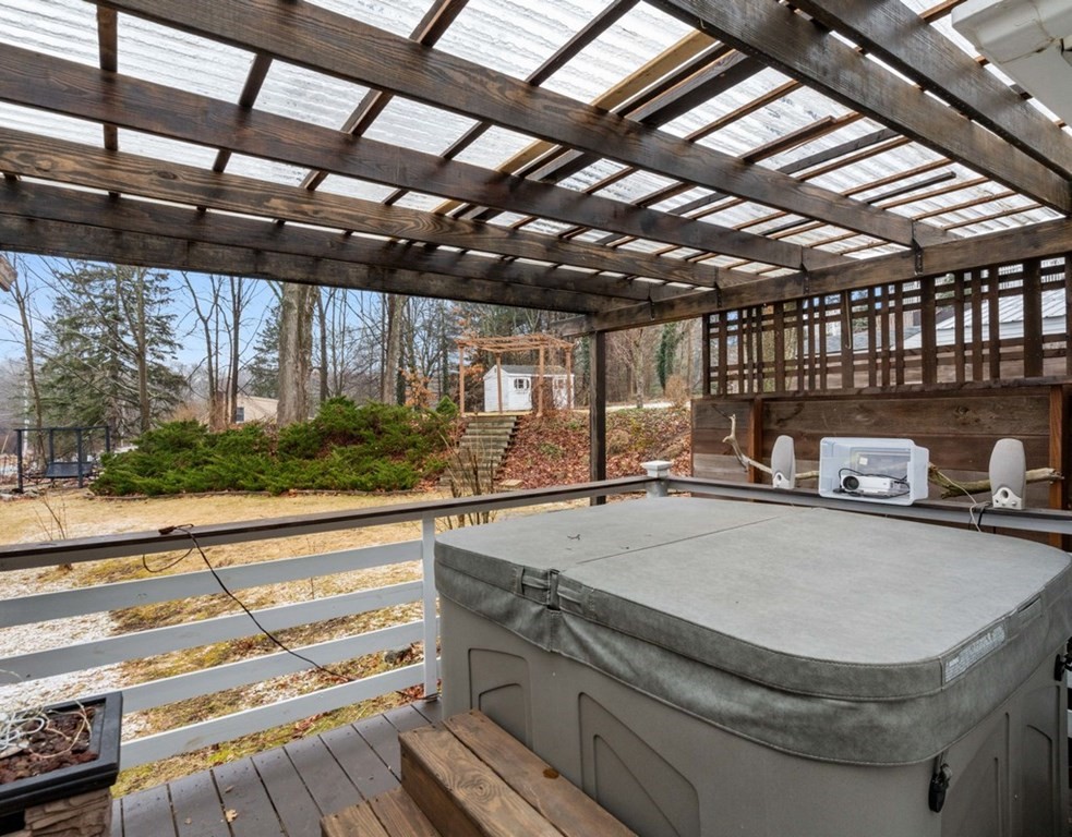 3 Upton Road Westborough, MA 01581 - Photo 23 of 34 a view of garage with a sink and wooden floor