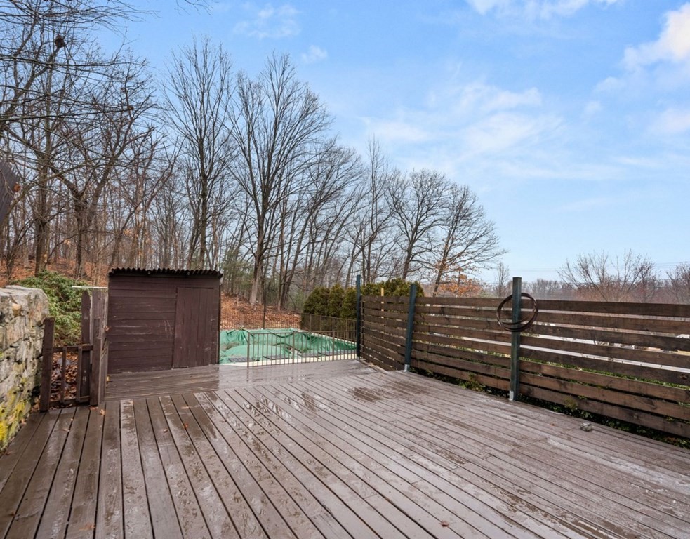 3 Upton Road Westborough, MA 01581 - Photo 24 of 34 a view of a backyard with wooden floor and fence
