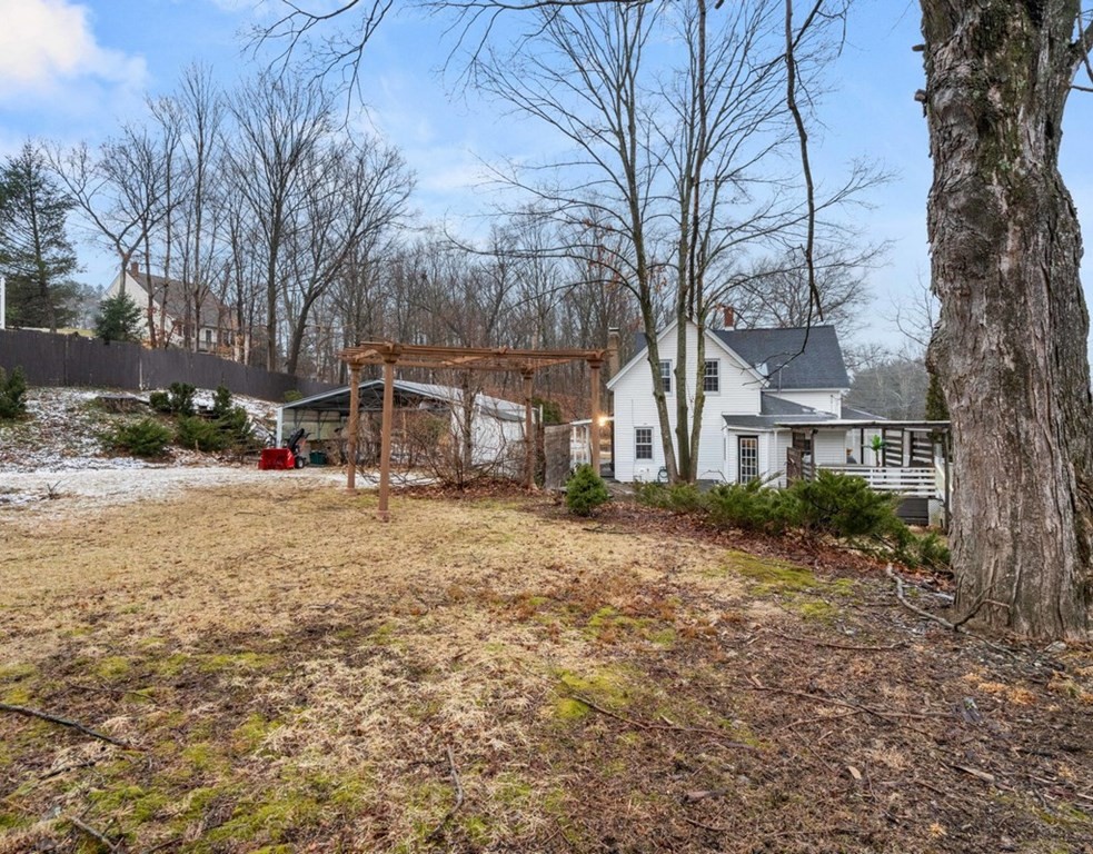 3 Upton Road Westborough, MA 01581 - Photo 29 of 34 a view of a yard with a house and a tree