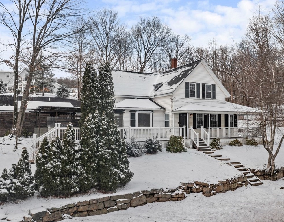 3 Upton Road Westborough, MA 01581 - Photo 3 of 34 a front view of a house with a yard covered with snow