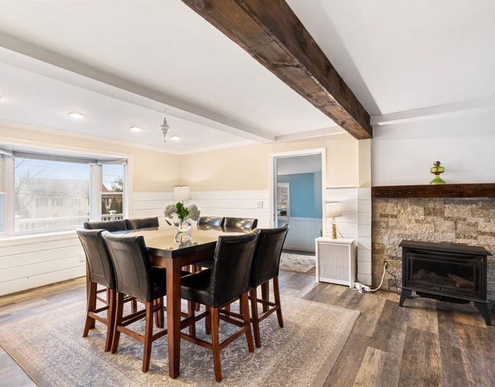 3 Upton Road Westborough, MA 01581 - Photo 5 of 34 a view of a dining room with furniture window and wooden floor