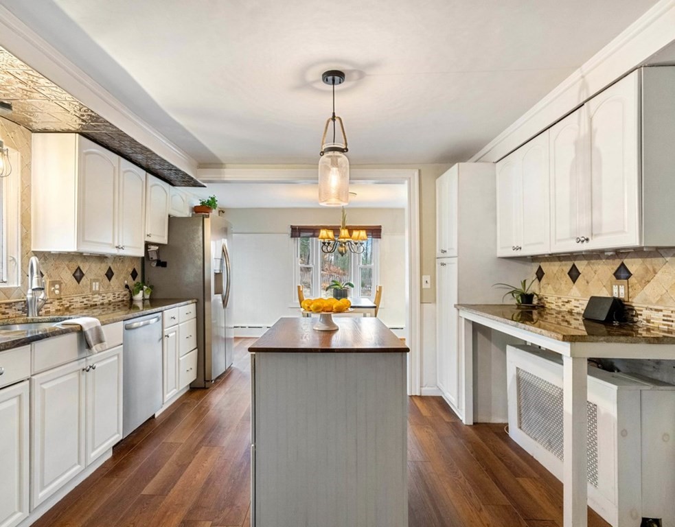 3 Upton Road Westborough, MA 01581 - Photo 8 of 34 a kitchen with white cabinets and white appliances