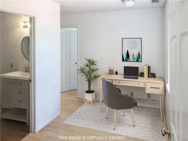 a workspace with furniture and window