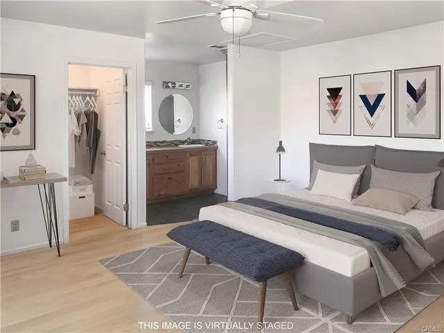 a bedroom with a bed and a mirror