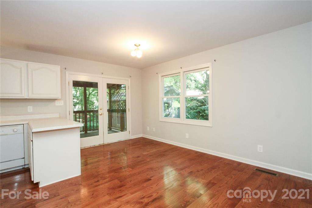 6204 Potter Road Matthews, NC 28104 - Photo 15 of 31 a view of a kitchen with wooden floor and a window