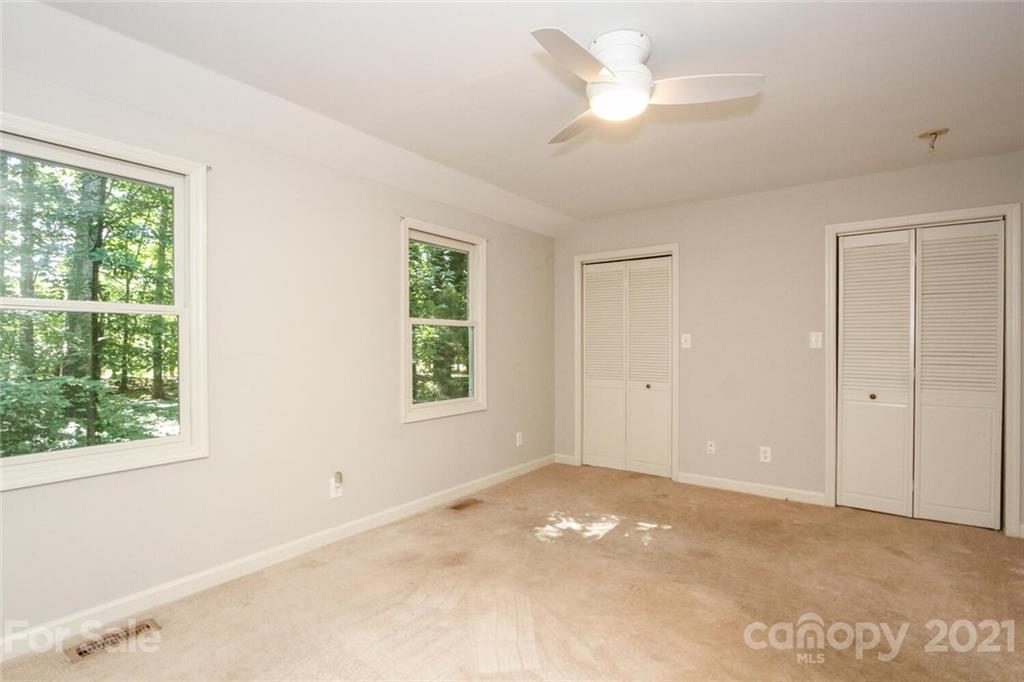 6204 Potter Road Matthews, NC 28104 - Photo 17 of 31 a view of an empty room with a window