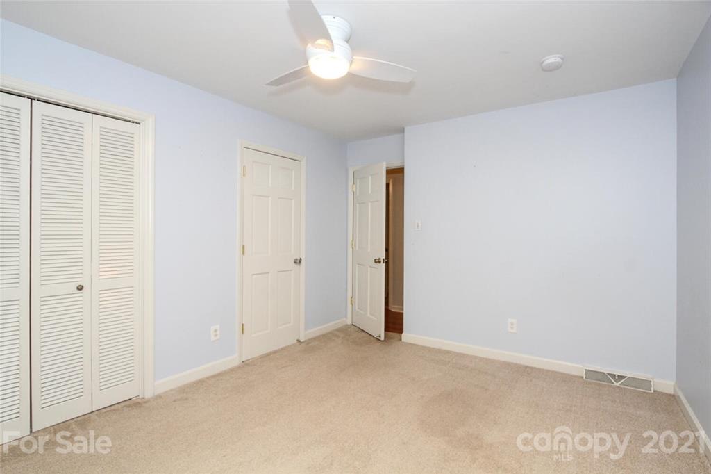 6204 Potter Road Matthews, NC 28104 - Photo 20 of 31 an empty room with a ceiling fan and a window
