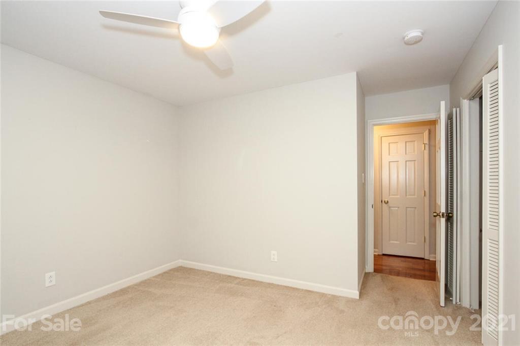 6204 Potter Road Matthews, NC 28104 - Photo 22 of 31 an empty room with windows and closet