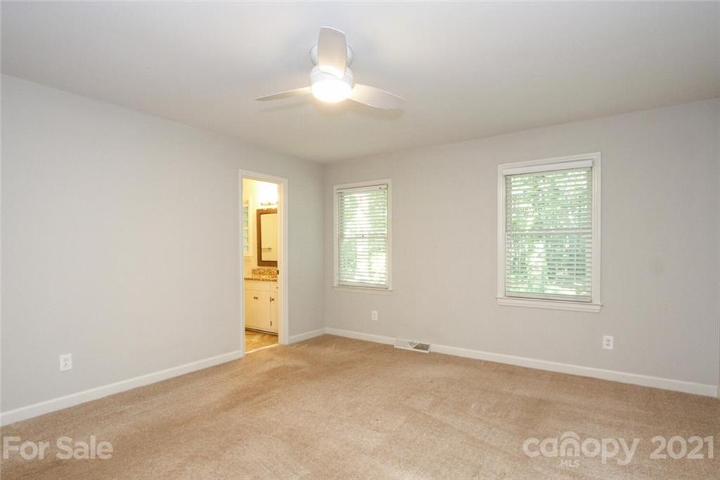 6204 Potter Road Matthews, NC 28104 - Photo 25 of 31 a view of an empty room with a window