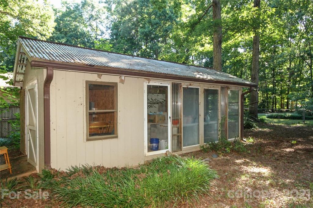 6204 Potter Road Matthews, NC 28104 - Photo 30 of 31 a view of a house with a yard