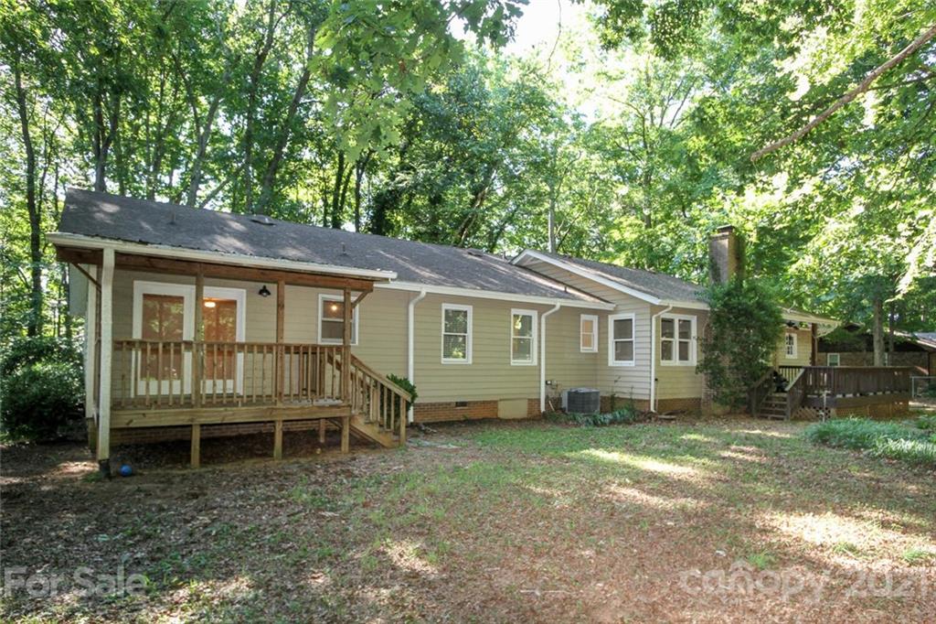 6204 Potter Road Matthews, NC 28104 - Photo 31 of 31 a house with trees in the background
