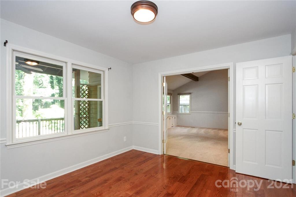 6204 Potter Road Matthews, NC 28104 - Photo 8 of 31 an empty room with wooden floor and windows