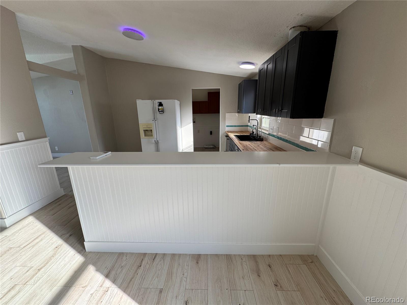 475 Pierce Street Erie, CO 80516 - Photo 3 of 16 a view of a living room with a sink
