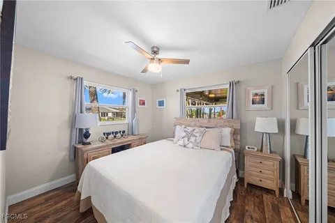 a bedroom with a bed and a desk