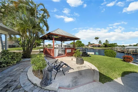 a view of a backyard with sitting area