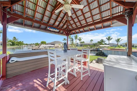 a view of a patio with a table and chairs