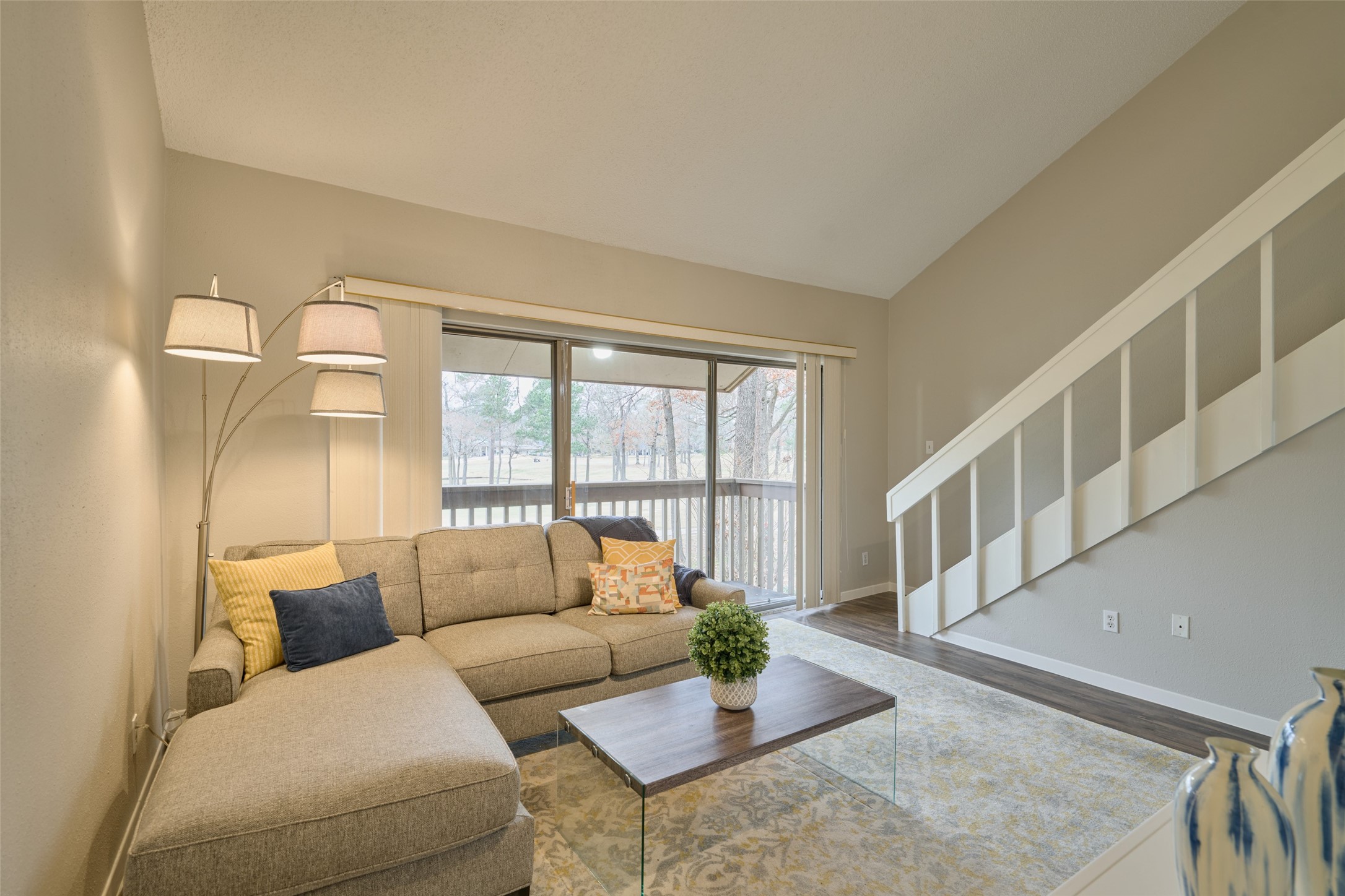 12900 Walden Road, Unit 602F Montgomery, TX 77356 - Photo 11 of 26 Another living room view showing staircase to 2nd bedroom with full bath & huge walk-in closet