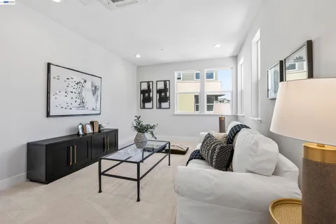 a living room with furniture and a night stand