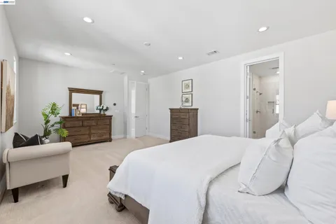 a bathroom with a double vanity sink mirror and shower