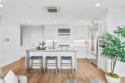 a kitchen with counter space dining table and chairs