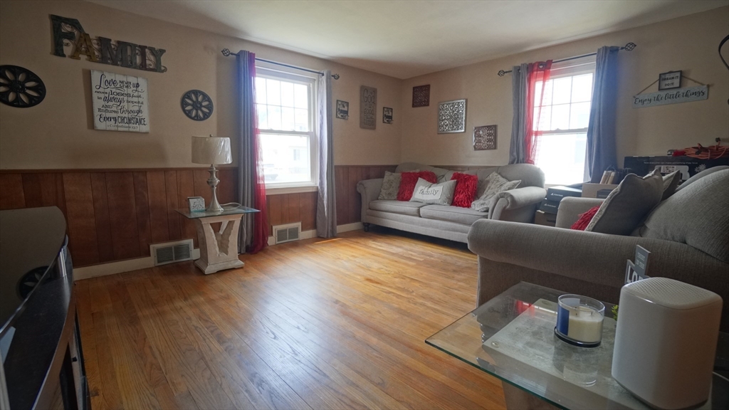 41 Parallel Street Springfield, MA 01104 - Photo 14 of 35 a living room with furniture and a window