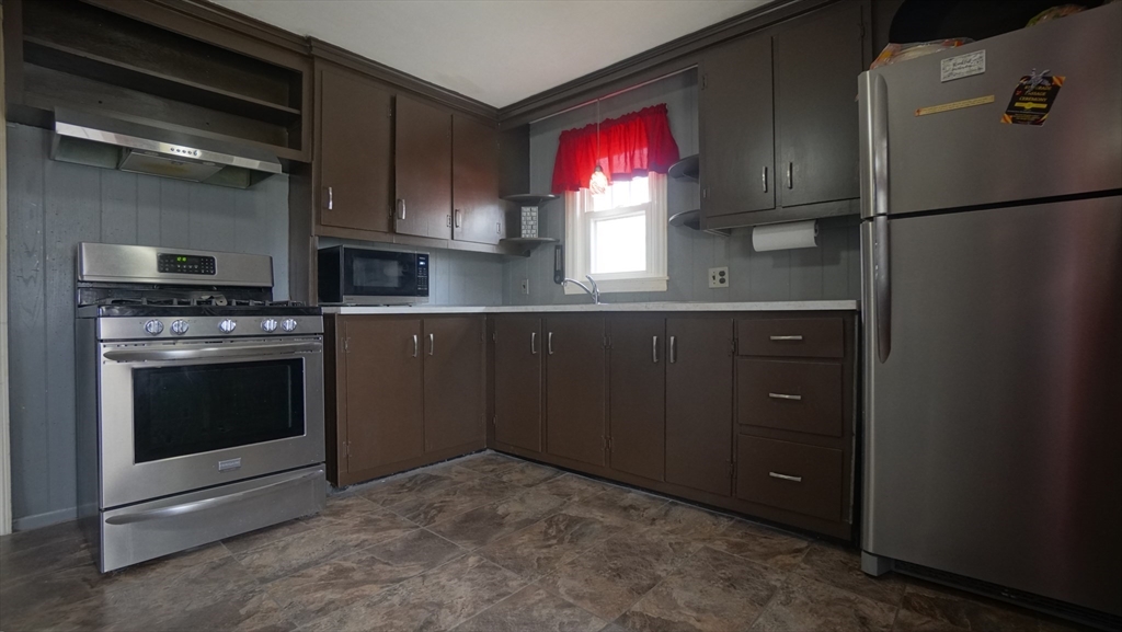 41 Parallel Street Springfield, MA 01104 - Photo 15 of 35 a kitchen with stainless steel appliances a refrigerator and a stove