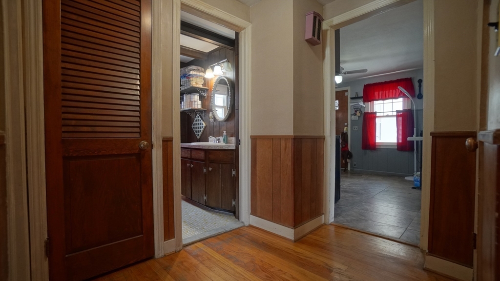 41 Parallel Street Springfield, MA 01104 - Photo 18 of 35 a view of a hallway with wooden floor and windows in a room
