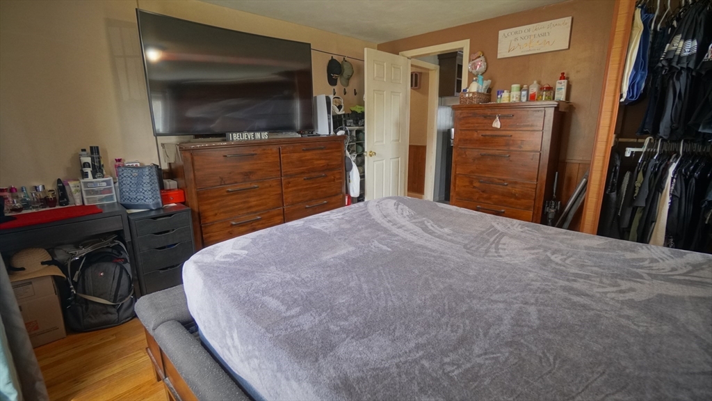 41 Parallel Street Springfield, MA 01104 - Photo 22 of 35 a bedroom with a bed and a flat screen tv